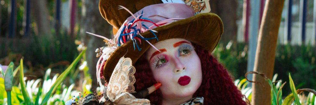 woman dressed as the mad hatter from alice in wonderland