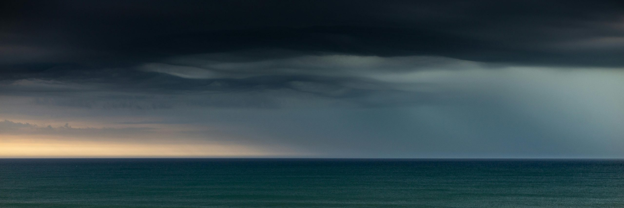 Types of Weather That Can Affect Migraines (and Why They Do) thunderstorm over ocean