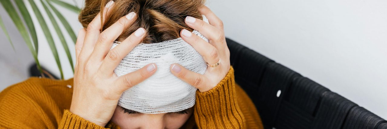 person with migraine ice cap on