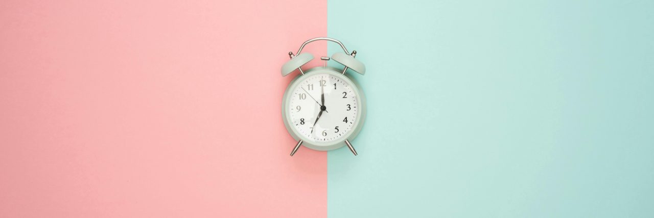 clock with pink and blue background