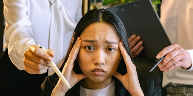 stressed woman being asked to do a lot of work
