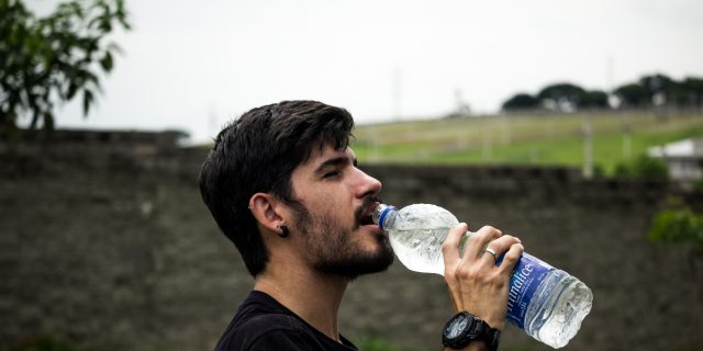 What Is Polydipsia? Why You're Still Thirsty After Drinking a Gallon of Water person drinking a water bottle outside