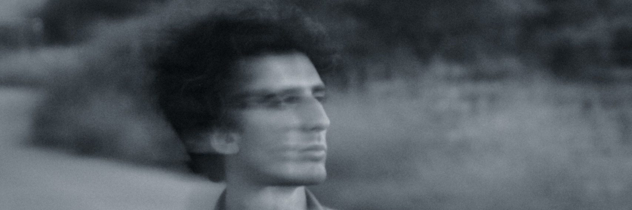 blurry photo of a man outside