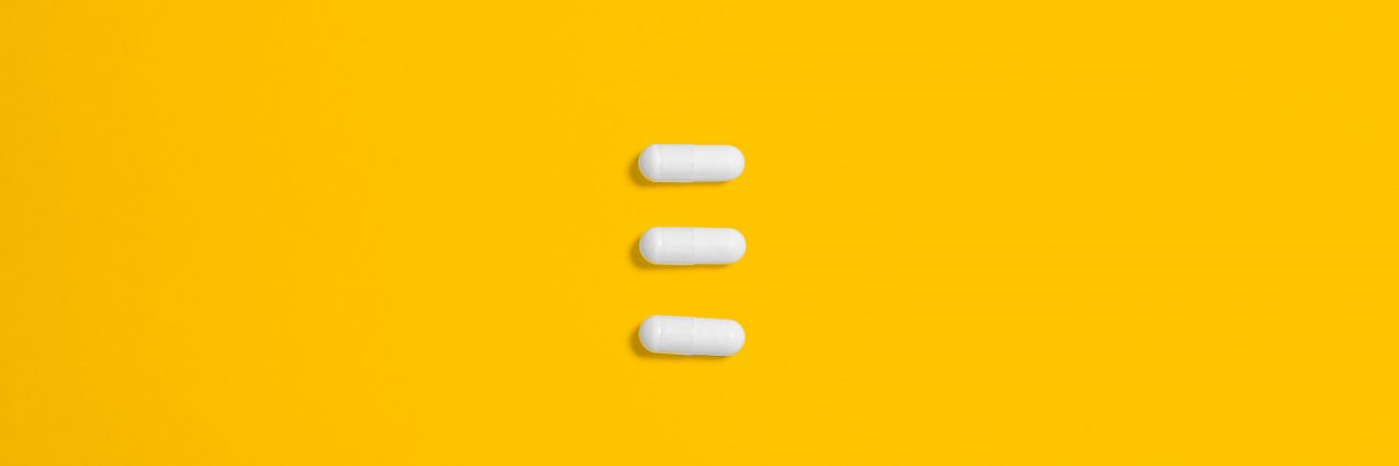 'Weird' Triptan Side Effects three triptan migraine medication on a yellow backdrop
