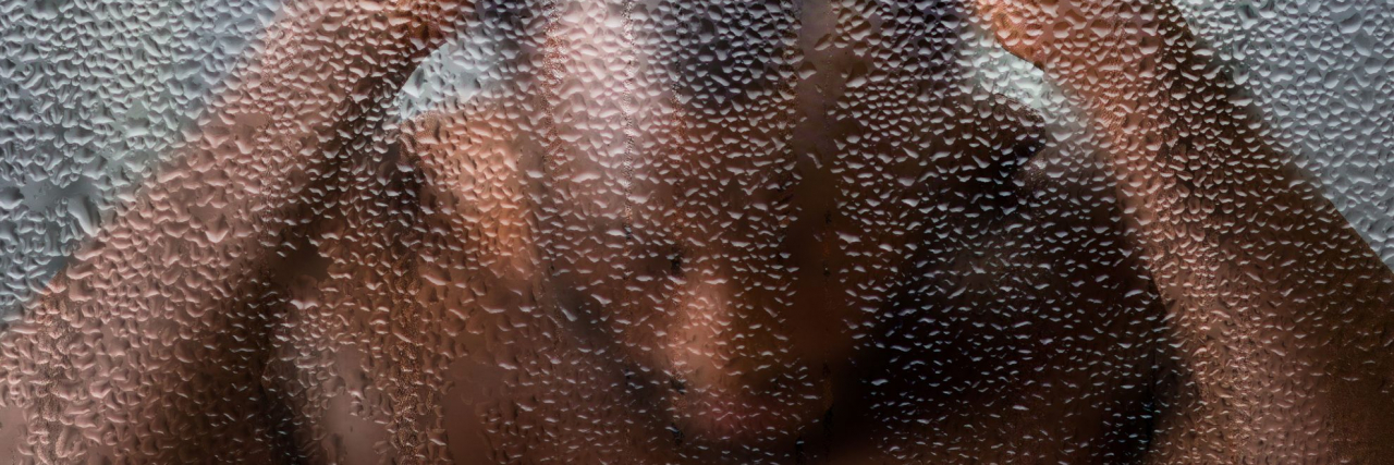 What's a Migraine Shower? person with a headache in the shower